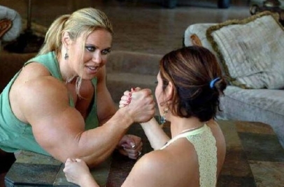 Two women arm wrestling