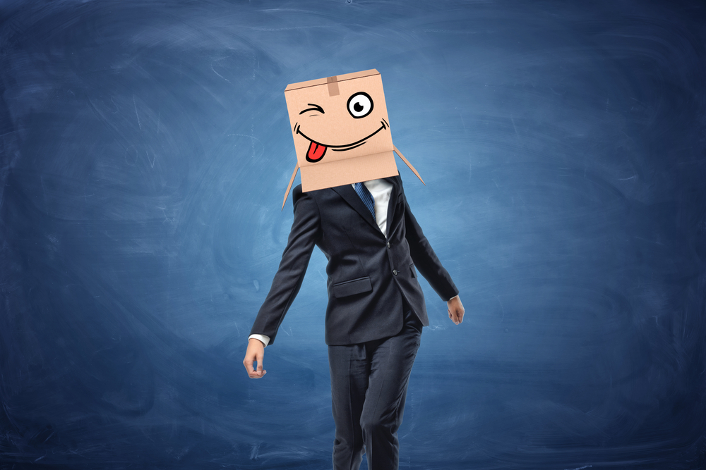 man in a suit with box on his head - Outsmarting the competition