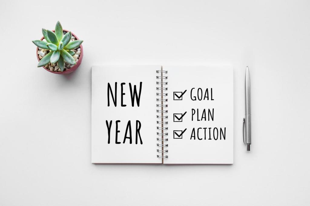 notebook with new year and goal, plan, action checklist