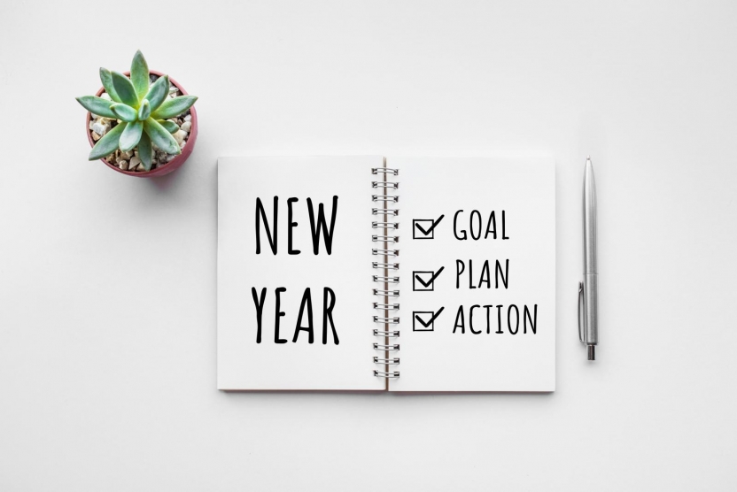 notebook with new year and goal, plan, action checklist