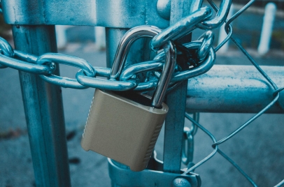 locked padlock and chain on a gate