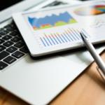 8 Common Google Analytics Mistakes to Avoid laptop and tablet with data charts