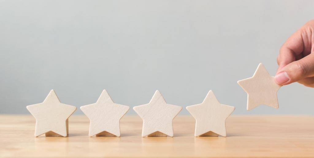 five wooden stars representing customer reviews