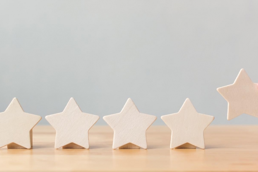 five wooden stars representing customer reviews