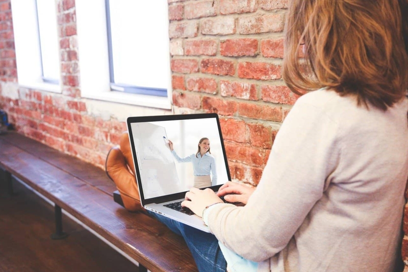 Woman attending an online webinar presentation