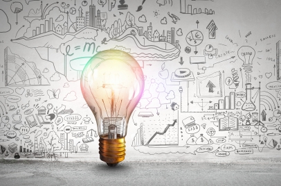 business growth strategy concept - lightbulb in front of a board full of ideas