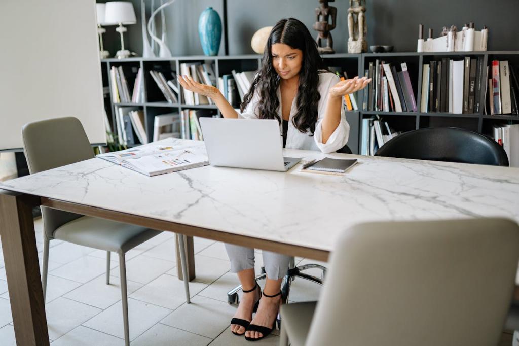a confused woman looking at her laptop